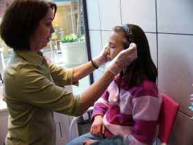 A getting her ears pierced!